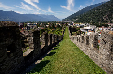 Perspective view of Murata - old city fortifications and Castelgrande castle in background, Bellinzona, Ticino, Switzerland