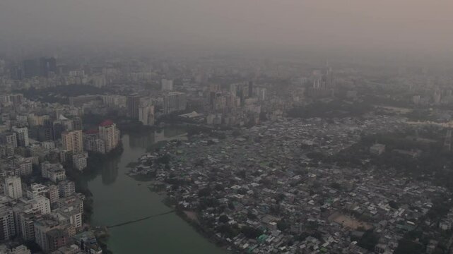 Aerial footage of Karail slum area and Banani residential district at sunset in Dhaka, Bangladesh