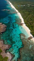 Aerial View of a Pristine Caribbean Coastline with Crystal Clear Turquoise Waters, White Sandy Beach, and Lush Greenery – iPhone Wallpaper