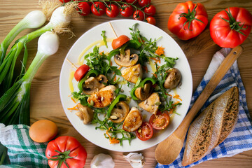 Turkey skewers with mushrooms and vegetables. Top view table.