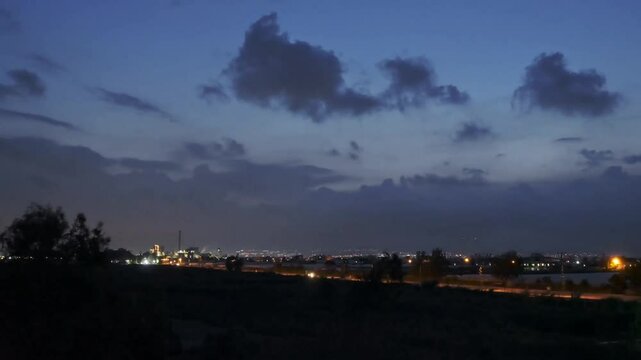Time-lapse footage from dusk till night over the highway roads and a factory nearby Kazanli, Turkey