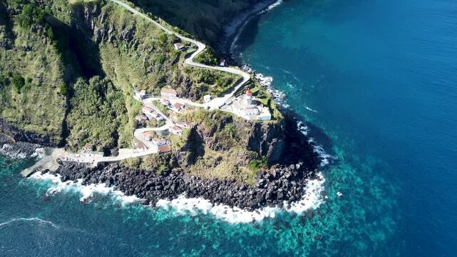 Aerial footage of the Arnel Lighthouse, at the tip of the Arnel, Sao Miguel island, Azores, Portugal