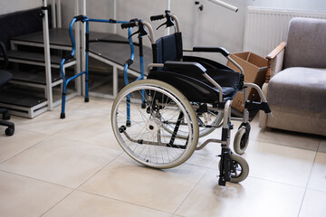 Empty wheelchair in a medical facility with accessibility equipment