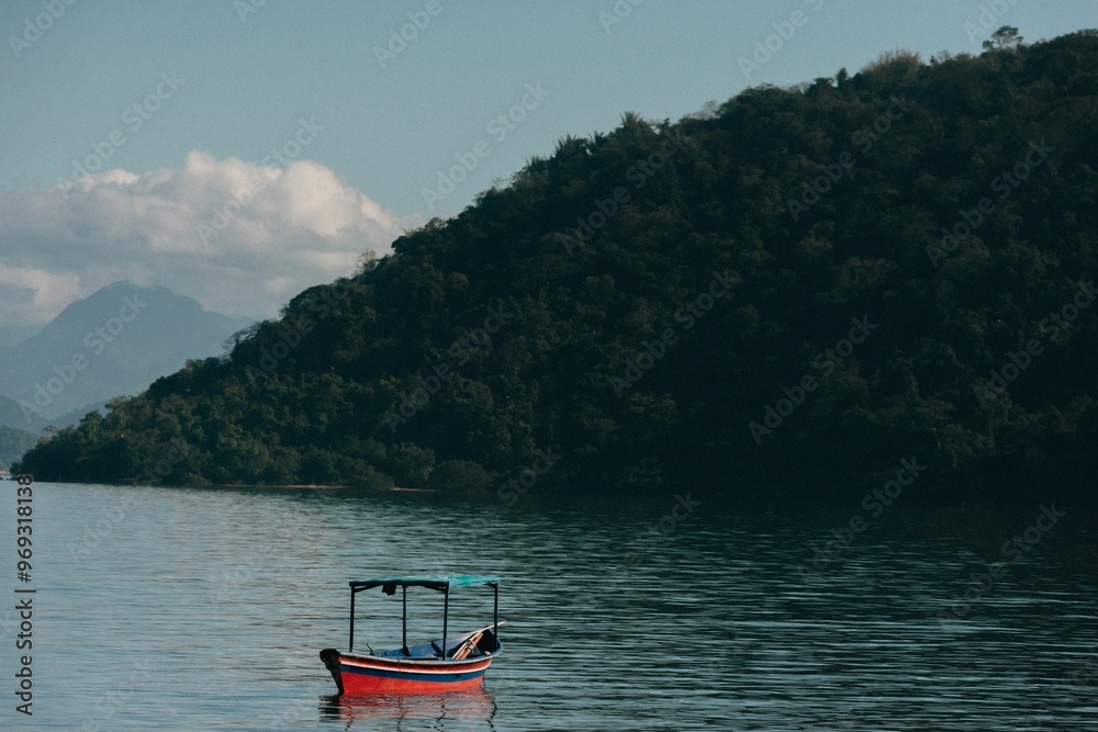 Sticker Serene lake with boat and green hills