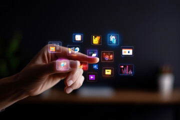 Hand interacts with floating holographic app icons, showcasing futuristic touchless technology. Innovative digital interface demonstrates advanced user experience in dark, dramatic setting.