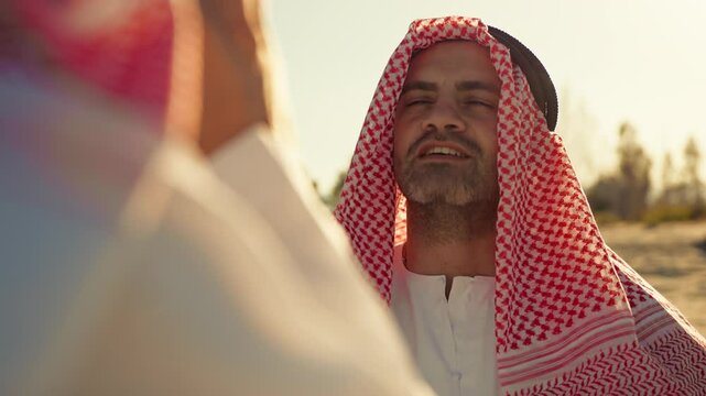 Sheik Suggesting What To Say To His Friend Having A Call