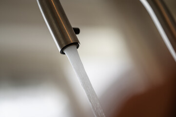 Close up of a tap with running water
