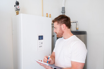 Technician checks the operation of a heat pump in a house.