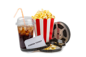 Tasty popcorn in buckets and cold cola drinks with cinema tickets, movie clapper and 3D eyeglasses...