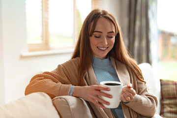 Cozy Moment of Joy With Warm Cup of Coffee in Sunlit Living Room in Autumn