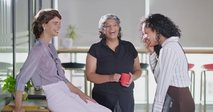 Indian young adult women intern old aged lady hold cup mug drink coffee talk gossip work place expert teen girl staff group team speak idea blab share enjoy fun joy tea break day spend time job office