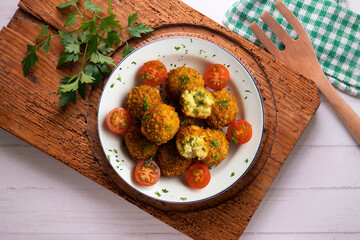 Vegan Chickpea balls coated with panko. Top view table.