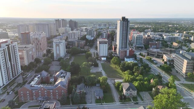 Aerial footage of the Waterloo urban cityscape on a clear sunny day in Ontario Province, Canada
