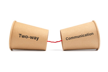 Two way communication concept by old style cup phone, isolated on white background