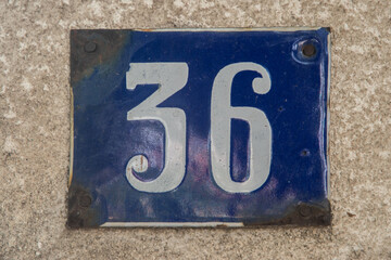 Obraz premium Weathered enameled plate of street address with number 36