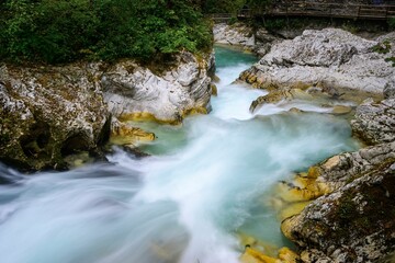 Long exposure river flowing through rocky gorge