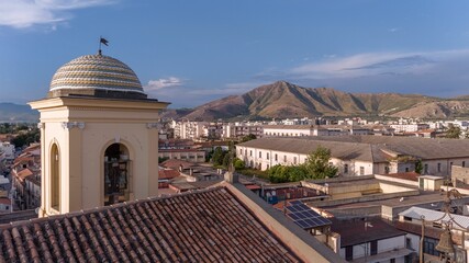 Aerial of the church of St. Erasmus in Santa Maria Capua Vetere with mountains in the background