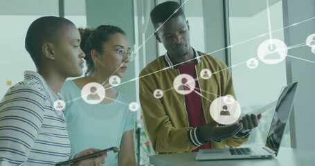 Animation of network of connections with people icons over diverse business people in office