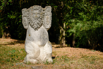 The figure of the ancient gods on the stones in the autumn park. Ukraine. Scythian culture