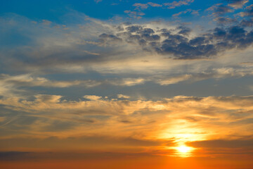 Sunrise sky with lighted clouds.