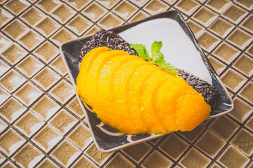 Mango Sticky Rice with black sticky rice, fresh mango and cream