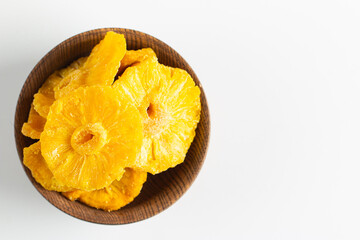 Dried pineapple in a bowl. Dried fruits. 