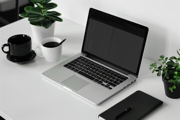  Close up of laptop and coffee cup on a bright white office desk workspace