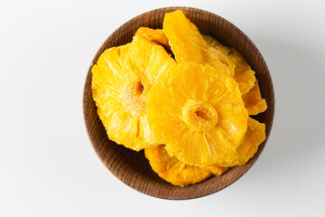 Dried pineapple in a bowl. Dried fruits. 
