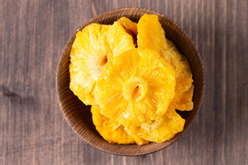 Dried pineapple in a bowl. Dried fruits. 