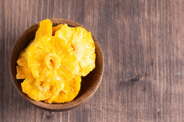 Dried pineapple in a bowl. Dried fruits. 