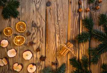 Traditional Czech Christmas on wood decoration with twig, apple, orange, fruit