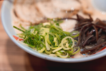 Close-Up of Tonkotsu Ramen with Kikurage Mushrooms, Green Onions, and Chashu Pork