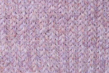 Texture of bright knitted fabric as background, top view