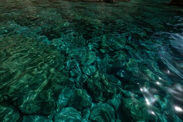 Beautiful turquoise water in the sunlight creating intricate patterns in Zakynthos Island, Greece