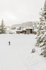 Child cross country skiing at mountain resort