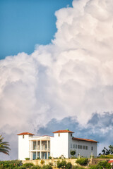 Albanian city with clouds in the blue sky