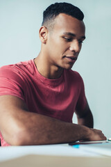 Diverse male friends reading notification message for smartphone application during time togetherness, handsome hipster guys watching online video on website connected to 4g wireless internet