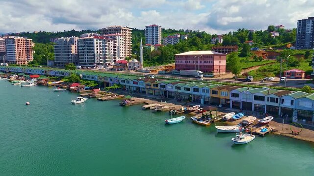 Boats are docked in the water near.