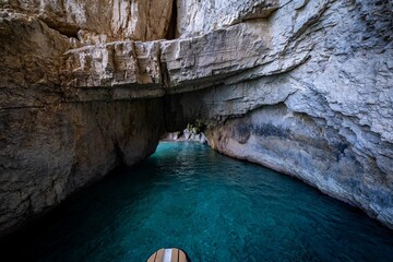 Inside view of a cave with turquoise waters of the Ionian Sea on Zakynthos Island, Greece