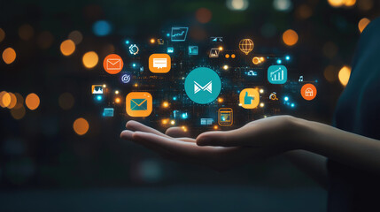 A person's hand holding a glowing digital icon with numerous other icons representing different apps and online functions around it.