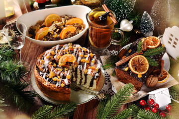 Traditional sweet Christmas Eve's supper in Poland with poppy seed cake, noodles, gingerbread cake and compote
