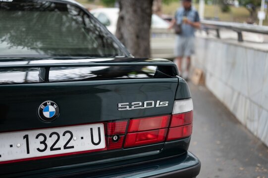 classic BMW 5 series E34 with the letters that say 520is.