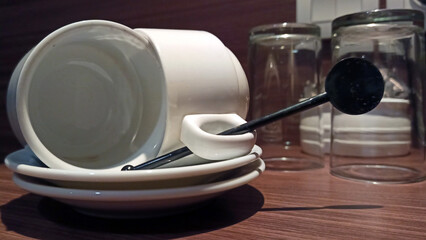Empty cups and small plates for making drinks on the table