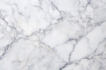 Fototapeta premium Minimalist white marble textured background with subtle grey veins, perfect for showcasing products, designs, or