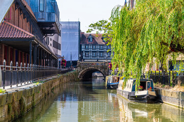 A view from a boat along the River Witham under the High bridge in Lincoln, Lincolnshire in...