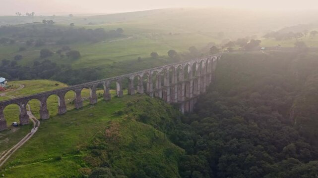 Aqueduct between mountains at sunrise with cloudy sky in arcos del sitio in tepotzotlan state of mexico