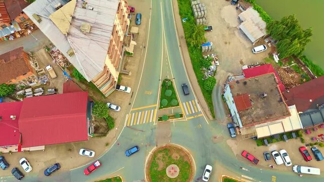 Aerial view a city intersection with cars.