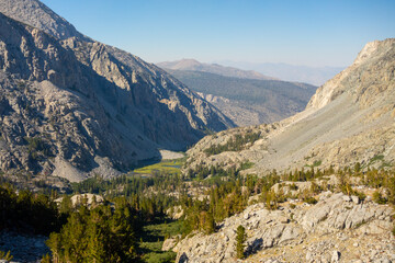 Views of tall jagged mountain peaks, large pine forests, rivers and streams, valleys and feilds, while backpacking through the John Muir Wilderness outside of Big Pine, CA.