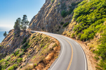 Beautiful landscape of Pacific Ocean coast along Highway 1 and Big Sur, aerial view, sunset, sunrise, fog. Concept, travel, vacation, weekend