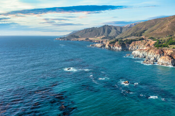 Beautiful landscape of Pacific Ocean coast along Highway 1 and Big Sur, aerial view, sunset, sunrise, fog. Concept, travel, vacation, weekend